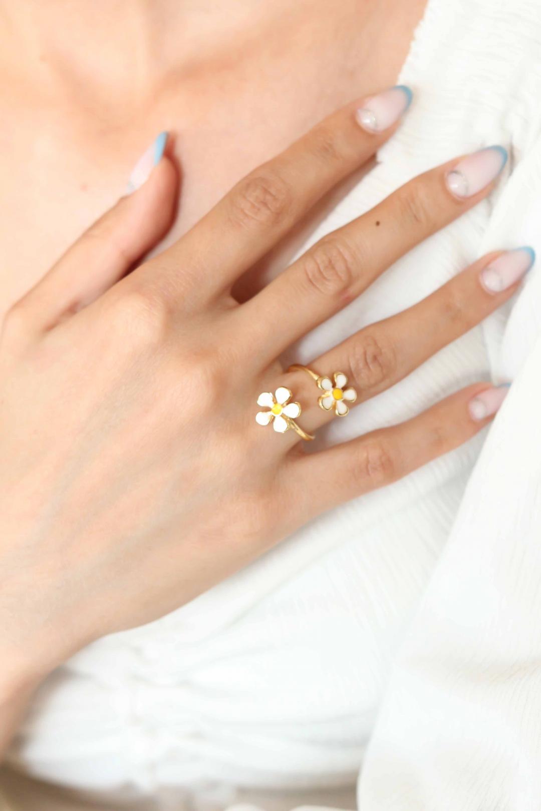 A Hand Wearing Adjustable Flower Ring